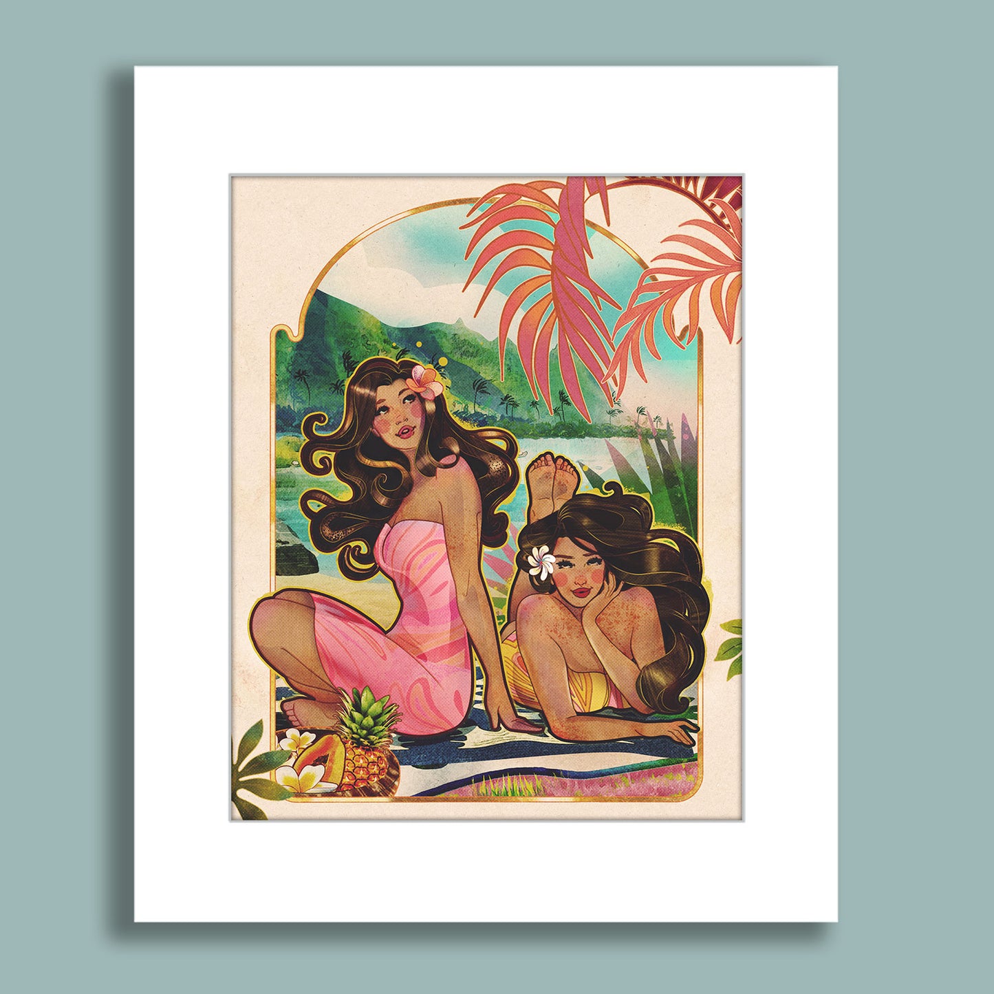 Two tropical women relaxing on a beach towel with pineapples and mountains in the background surrounded by palms.