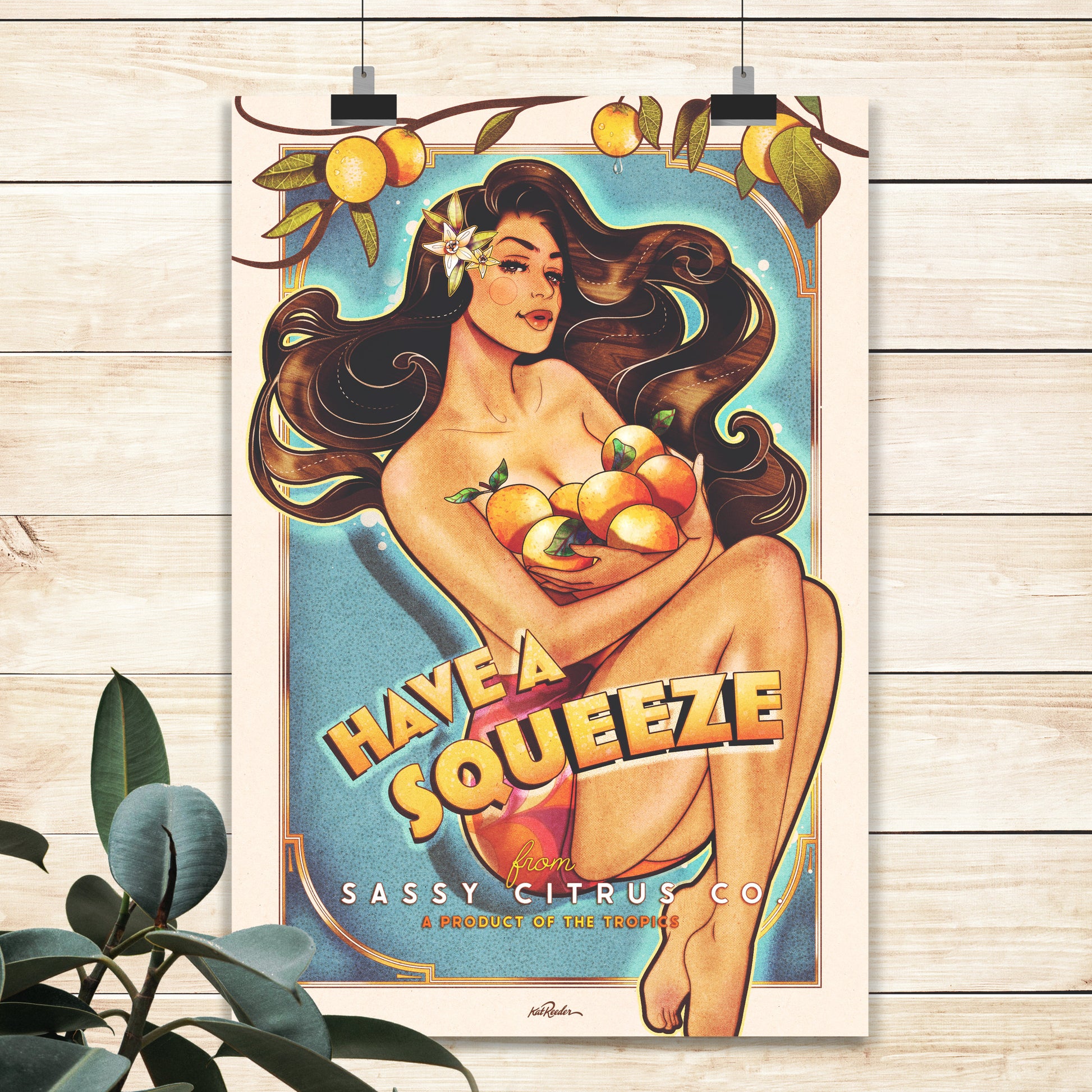 flat lay mockup of a large vintage style poster featuring a pinup holding oranges. Tropical fruit pinup poster features the words "have a squeeze"