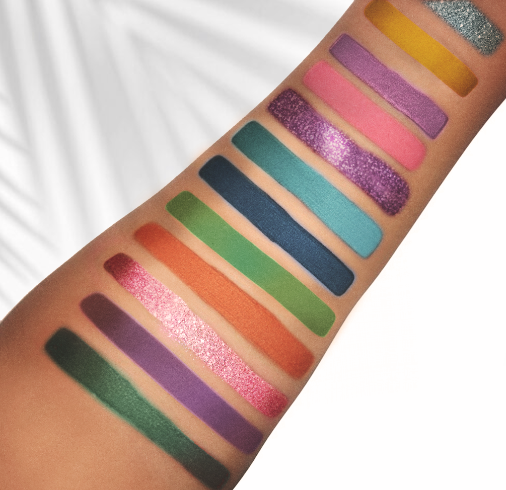 Arm swatches from Jungle Queen Shadow Palette's 12-high pigment shadows featuring warm and cool tones plus glitter eyeshadows.