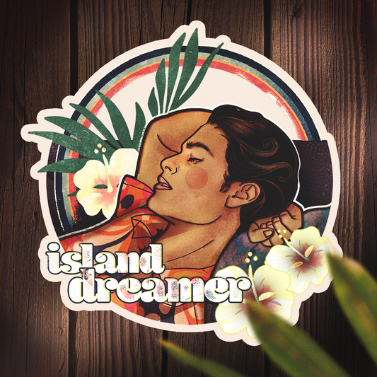 Round diecut waterproof sticker of a vintage-style surfer boy in the style of art nouveau with a 70s vibe. The sticker features the words "island dreamer"