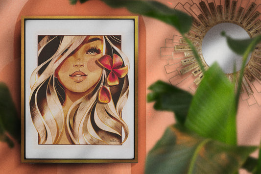 gold-framed canvas print of an illustration of a surfer girl with an orange plumeria in her ear. Girl features platinum hair and bold blue eyes. Framed canvas hangs in an orange boho room. 