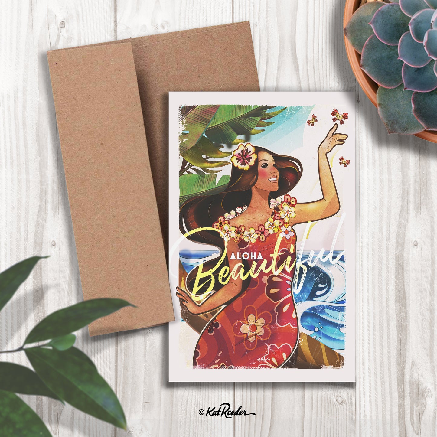 5x7 greeting card featuring an illustration of an island girl holding a butterfly in the style of vintage travel posters. The message on the front of the card reads “Aloha Beautiful". A kraft paper envelope is included with card. 
