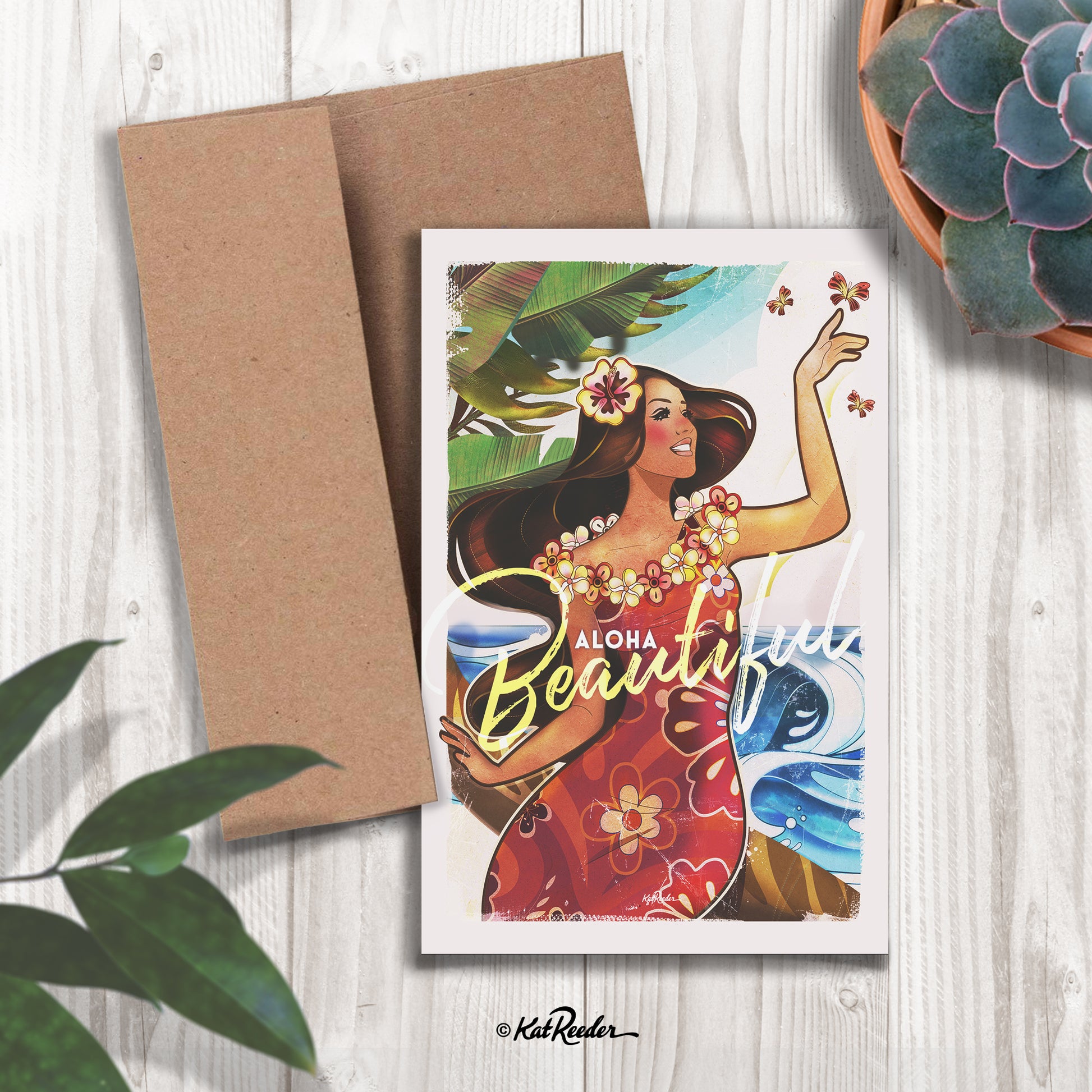 5x7 greeting card featuring an illustration of an island girl holding a butterfly in the style of vintage travel posters. The message on the front of the card reads “Aloha Beautiful". A kraft paper envelope is included with card. 