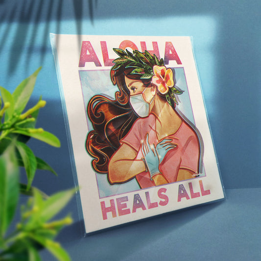 12x12 square print of an illustration of a nurse wearing a haku, a mask, gloves and doing a hula dance. She is framed by the words "Aloha Heals All"
